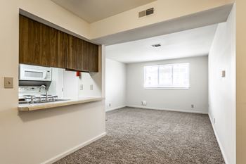 A room with a window and a microwave at Bay Pointe Apartments, Lafayette, Indiana